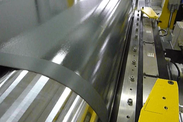 Detail of film coated with adhesive by the FKV head on the production line