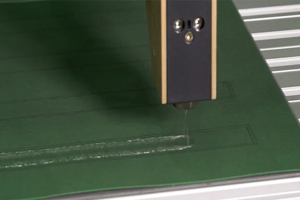 Precise, repeatable spray application of adhesive with the Delta head